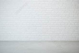Empty room with brick wall and concrete floor