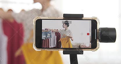 Fashion vlogger recording new video on mobile phone