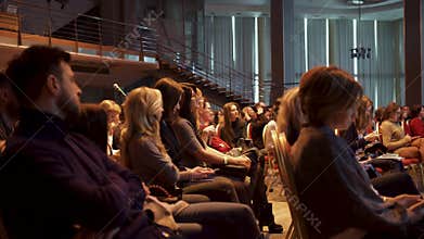 RUSSIA, MOSCOW - APRIL 13, 2019: Large female audience sitting in hall at presentation. Art. Important and informative