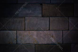 Old stone brick wall with dark vignette borders