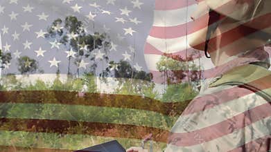 Military man in uniform using a tablet