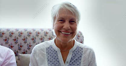 Front view of active Caucasian senior woman sitting in the nursing home 4k