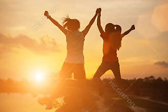 Strong confidence woman open arms under the sunset