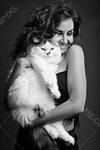 Young beautiful woman with curly hair posing in black and white