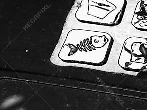 Old recycling sticker on garbage bin. Dead fish logo.
