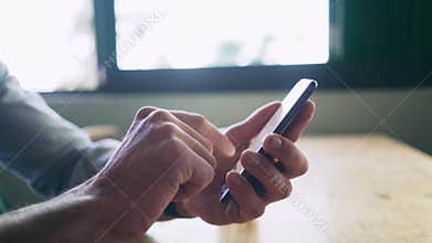 Cropped Hands Of Blogger Using Mobile Phone