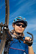 biker in helmet with bicycle