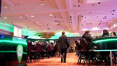 Motion of people playing table game and having fun inside Casino