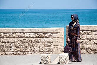 Muslim woman on the embankment of Tel Aviv, Israel