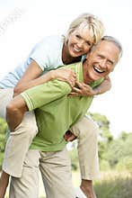 Mature couple having fun in countryside