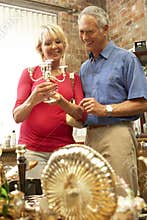 Middle aged couple shopping for antiques
