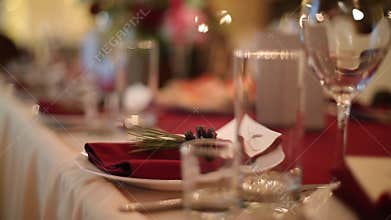 Christmas wedding banquet hall interior details with decorand table setting at restaurant. Winter season decoration of