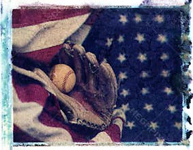 Baseball glove mit with baseball laying on red white and blue am