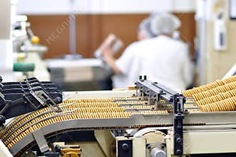 Food industry - biscuit production in a factory on a conveyor be