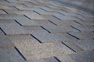 Close up view on Asphalt Roofing Shingles Background. Roof Shingles - Roofing