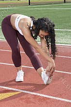 Stunning African-American fitness model on outdoor track