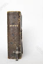 Antique Worn Leather Bible with Antique Metal and Wood Cross on