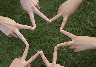 Fingers joined to form a star of six peaks