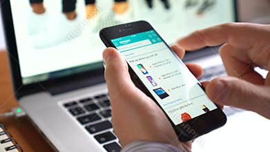 Man use iphone to shop online Amazon app on the screen