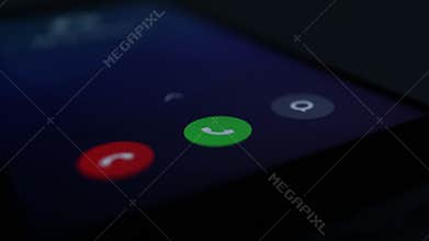 Incoming phone call indication on smartphone display close-up, answering an incoming call