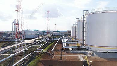 Metal Tanks with Natural Gas among Pipeline Upper View