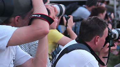 Photographers taking long range photos of event