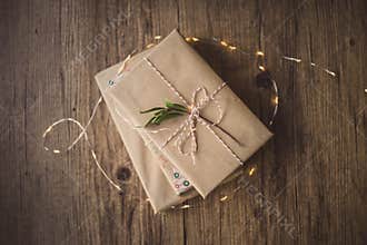 Wrapped books on a table and Christmas lights