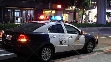 Night outdoor shot of red and blue emergency lights of police car