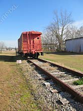 Old red caboose on railway