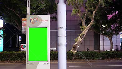 Motion of traffic flow during at night with green screen traffic board