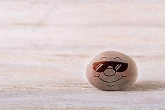 Smiling emoticon with sunglasses