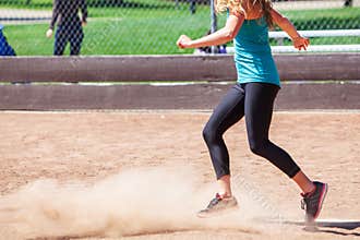 A Woman Plays a Game of Kickball