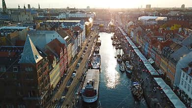Amzing Backlight sunset footage from Copenhagen, Denmark. bridge in Nyhavn New Harbour canal and entertainment district