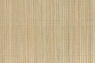Beige natural mat of dry wicker grass as texture, background.