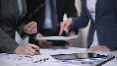 Business consultant giving advise to managers, discussing development plan