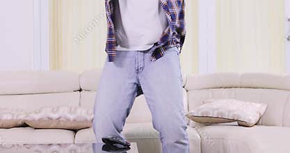 Young man watching sports match on TV
