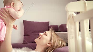 Happy mom with child. Mother enjoy baby laughing