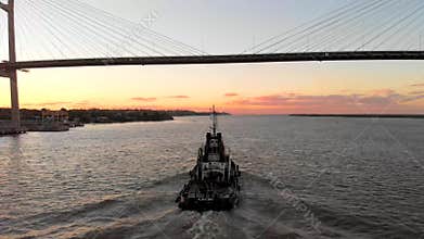 Tug boat under Rosario-Victoria Bridge, Santa Fe, Argentina.