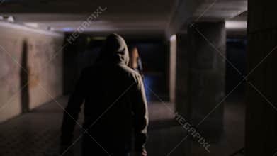 Woman being chased by criminal with knife at night