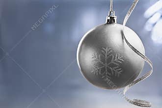 Silver Chrismast ball over blue background