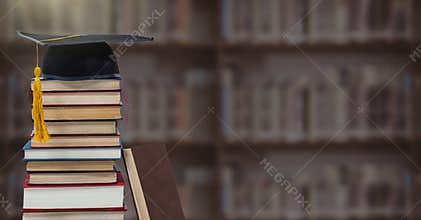 Books and graduation hat in education library