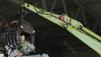 Garbage trash and plastic bottles splitters recycle process at the dump