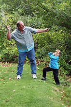 Uncle teaches nephew to skip stones