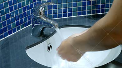 Washing hands soap bathroom closeup
