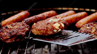 Grilling: burgers and hot dogs on charcoal fire