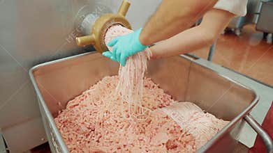 Industrial sausages production process at meat and sausage making plant. Meat processing equipment. Sausage production