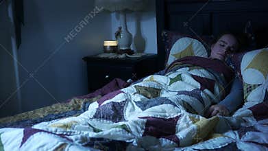 A woman suffering from restless leg syndrome