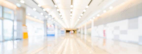 Blurred bokeh panoramic banner background of exhibition hall or convention center hallway. Business trade show event