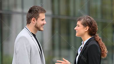 Businesspeople talking in the street