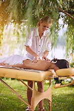 Woman receiving relaxation massage in nature on outdoor